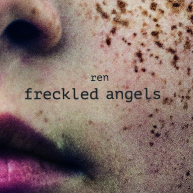 Cover art: A very close crop of a heavily freckled face, showing the bottom corner of the nose, bright pink lipstick on half a mouth, and a slightly blushed cheek. Text over the top reads: "Ren, freckled angels".