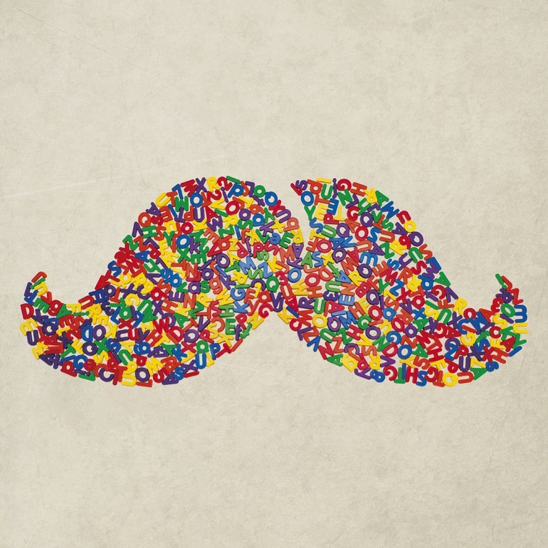 Cover art: A colourful moustache, sides twirled up, made out of magnetic letters and numbers in a jumbled pile, on a plain marble background.